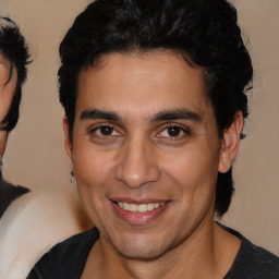 Joyful white young-adult male with medium  brown hair and brown eyes