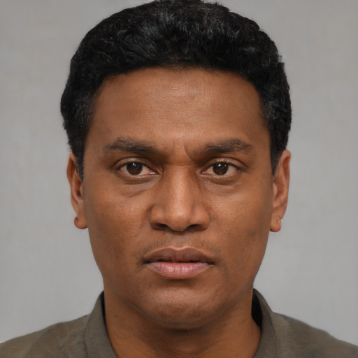 Neutral black adult male with short  black hair and brown eyes