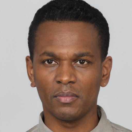 Neutral black young-adult male with short  black hair and brown eyes