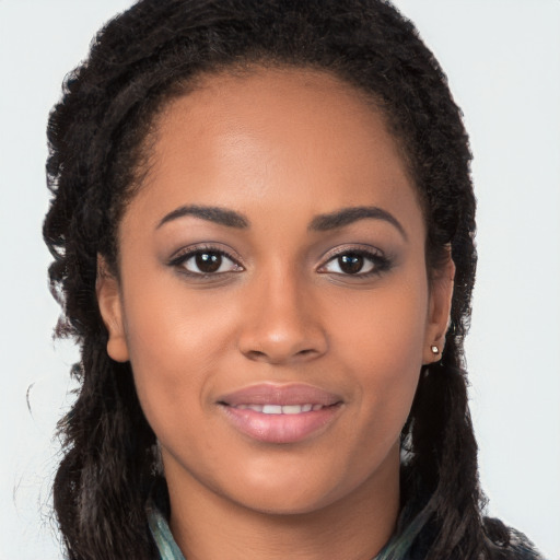 Joyful latino young-adult female with long  brown hair and brown eyes