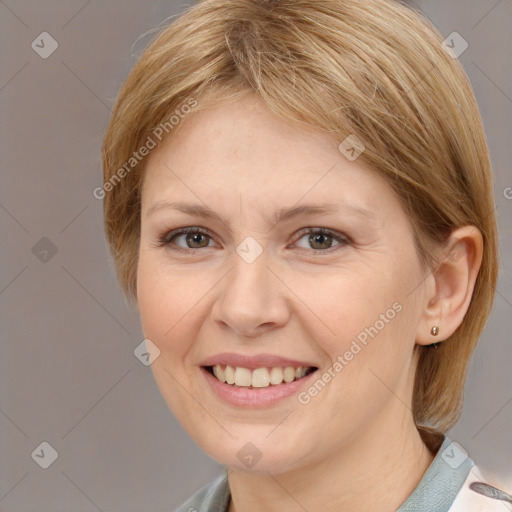 Joyful white adult female with medium  brown hair and brown eyes