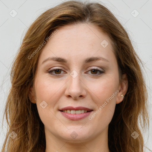 Joyful white adult female with long  brown hair and grey eyes