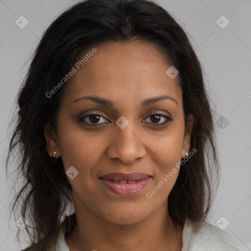 Joyful black young-adult female with long  brown hair and brown eyes
