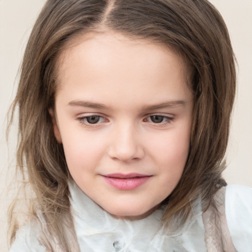 Joyful white child female with medium  brown hair and brown eyes