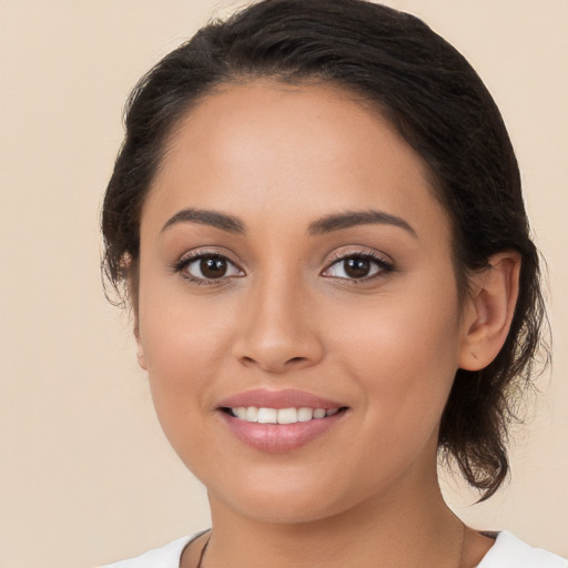 Joyful white young-adult female with medium  brown hair and brown eyes