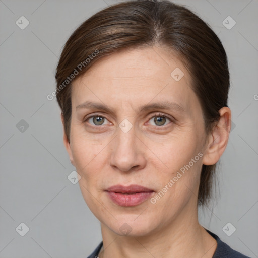 Joyful white adult female with medium  brown hair and grey eyes