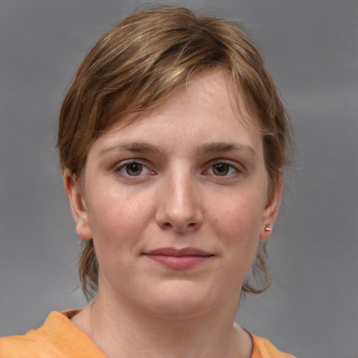 Joyful white young-adult female with medium  brown hair and grey eyes