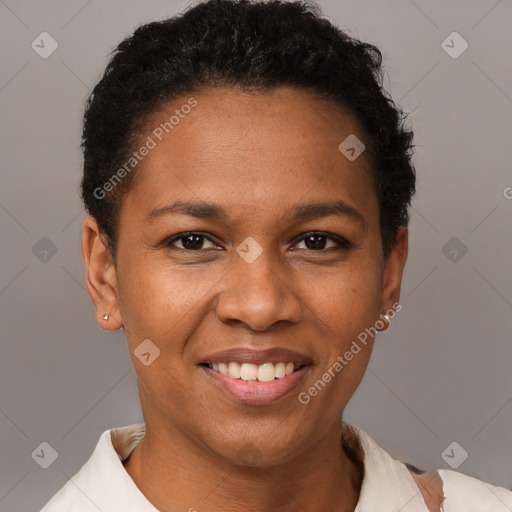 Joyful black adult female with short  black hair and brown eyes