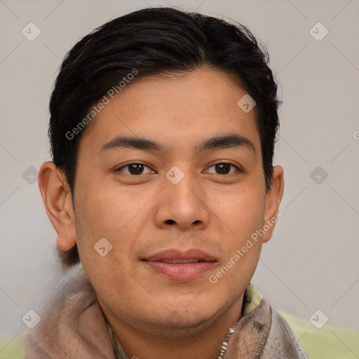 Joyful asian young-adult male with short  brown hair and brown eyes