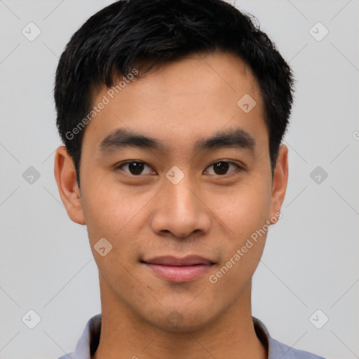 Joyful asian young-adult male with short  black hair and brown eyes