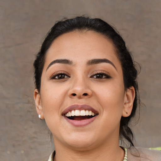 Joyful white young-adult female with medium  black hair and brown eyes