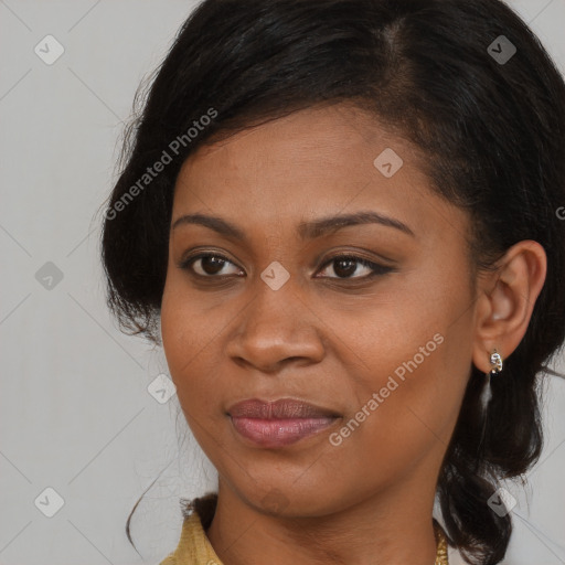 Joyful black young-adult female with long  brown hair and brown eyes