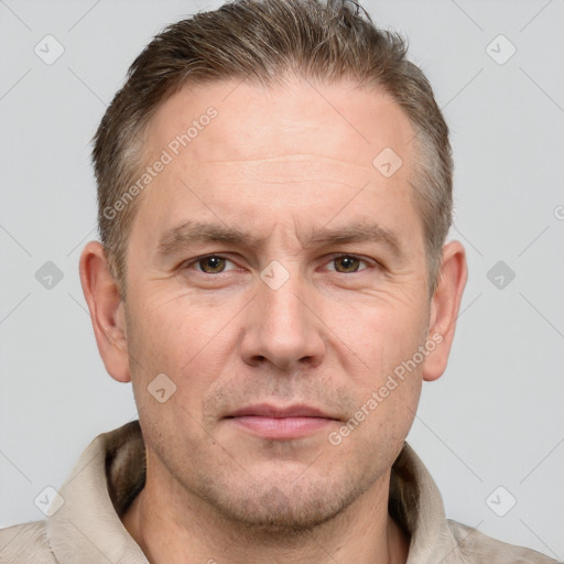 Joyful white adult male with short  brown hair and grey eyes