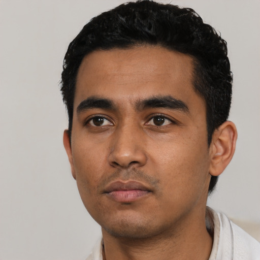 Neutral latino young-adult male with short  black hair and brown eyes