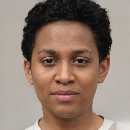 Joyful latino young-adult female with short  black hair and brown eyes