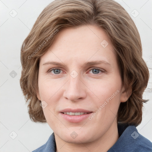 Joyful white young-adult female with medium  brown hair and blue eyes