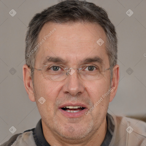 Joyful white middle-aged male with short  brown hair and brown eyes