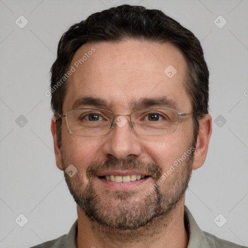 Joyful white adult male with short  brown hair and brown eyes