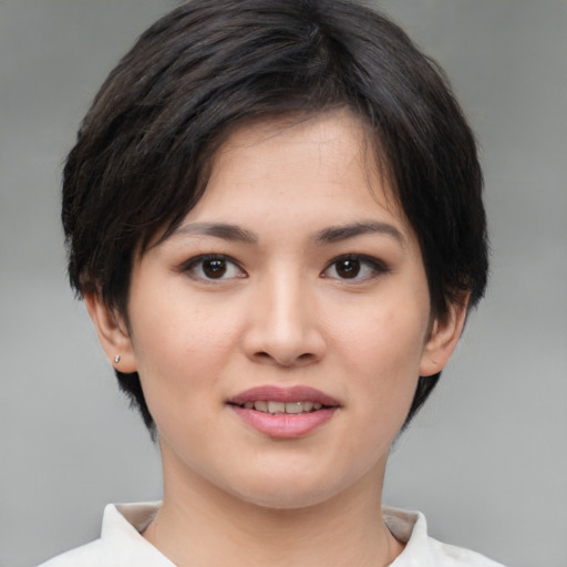 Joyful white young-adult female with medium  brown hair and brown eyes