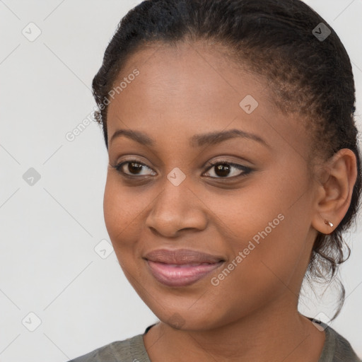 Joyful black young-adult female with long  brown hair and brown eyes