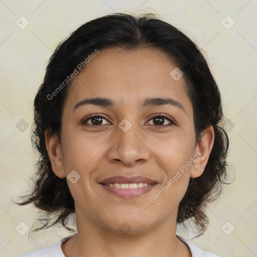 Joyful latino young-adult female with medium  brown hair and brown eyes