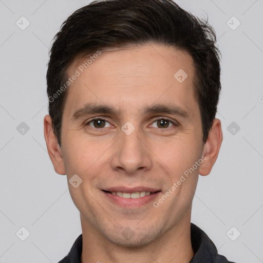 Joyful white adult male with short  brown hair and brown eyes