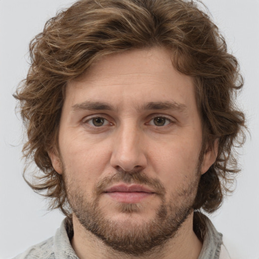 Joyful white young-adult male with medium  brown hair and brown eyes