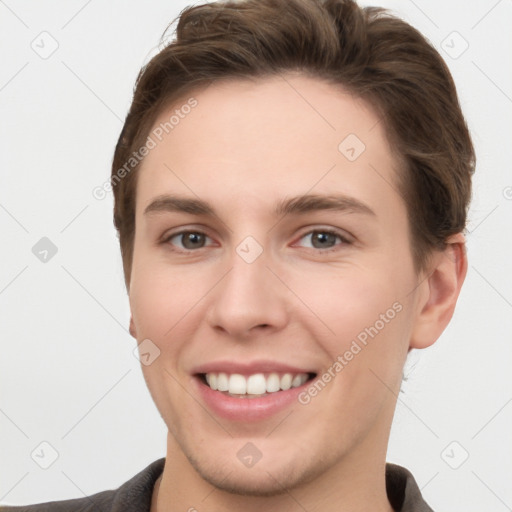 Joyful white young-adult female with short  brown hair and grey eyes