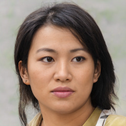 Neutral asian young-adult female with medium  brown hair and brown eyes