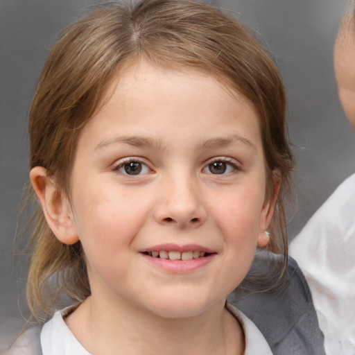 Joyful white child female with medium  brown hair and brown eyes