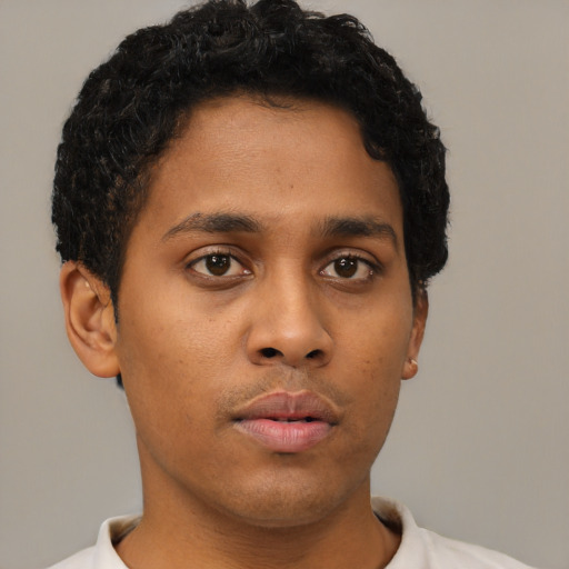 Neutral latino young-adult male with short  brown hair and brown eyes