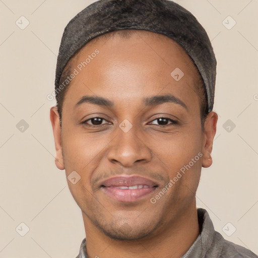 Joyful black young-adult male with short  black hair and brown eyes