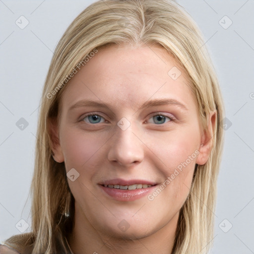 Joyful white young-adult female with long  brown hair and blue eyes