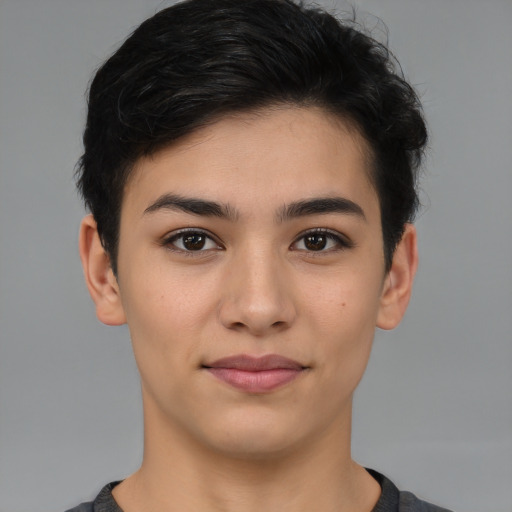 Joyful latino young-adult female with short  brown hair and brown eyes
