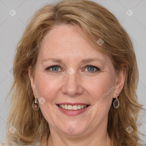 Joyful white adult female with medium  brown hair and blue eyes