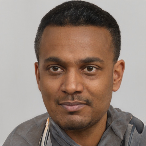Neutral black young-adult male with short  black hair and brown eyes