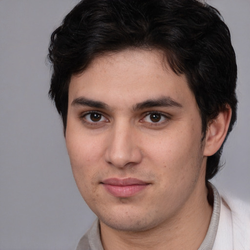 Joyful white young-adult male with medium  brown hair and brown eyes