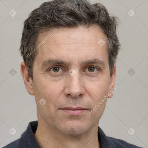 Joyful white adult male with short  brown hair and grey eyes