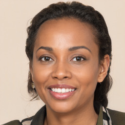 Joyful black young-adult female with medium  brown hair and brown eyes