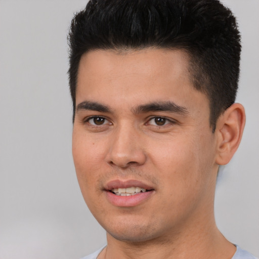 Joyful white young-adult male with short  black hair and brown eyes