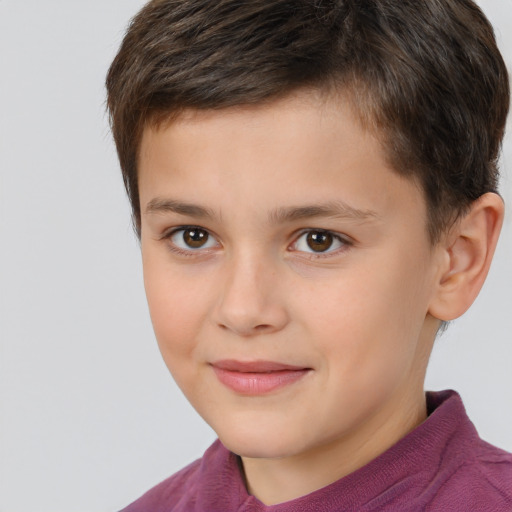 Joyful white child male with short  brown hair and brown eyes