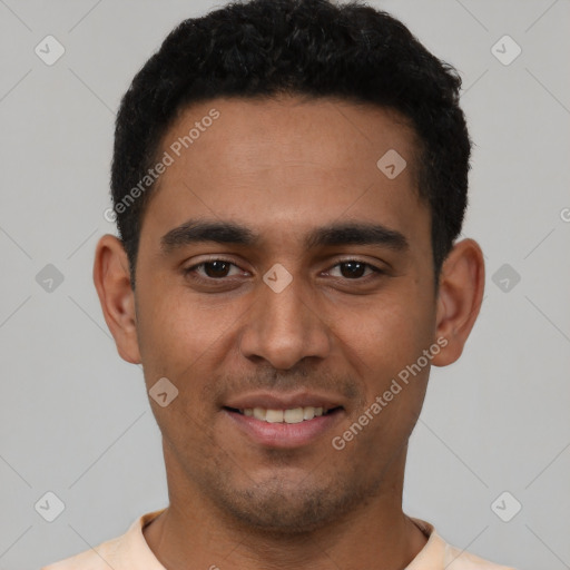 Joyful latino young-adult male with short  black hair and brown eyes