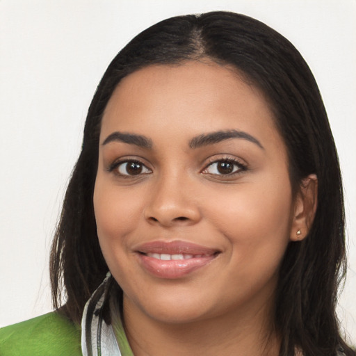 Joyful latino young-adult female with long  black hair and brown eyes