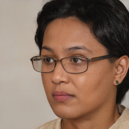 Neutral asian adult female with medium  brown hair and brown eyes