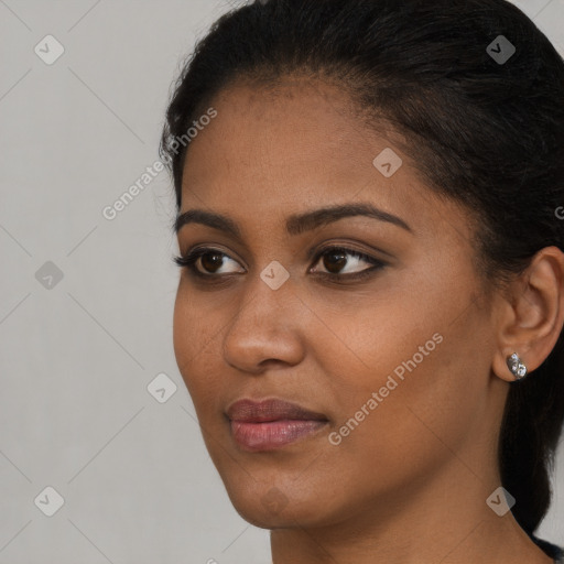 Neutral black young-adult female with long  brown hair and brown eyes