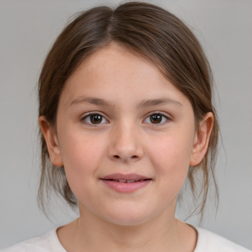 Joyful white child female with medium  brown hair and brown eyes