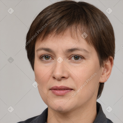 Joyful white adult female with short  brown hair and brown eyes