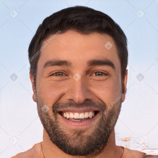 Joyful white young-adult male with short  black hair and brown eyes