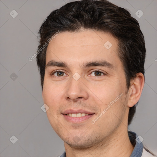 Joyful white adult male with short  brown hair and brown eyes