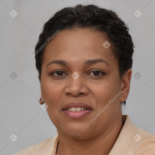 Joyful latino adult female with short  brown hair and brown eyes